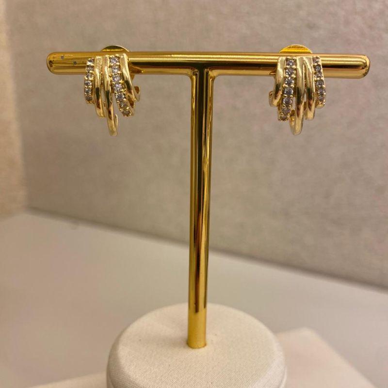 Brinco garras lisas e cravejadas