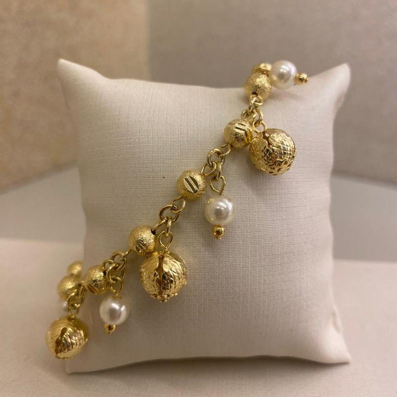 Pulseira bola trabalhada com pérola